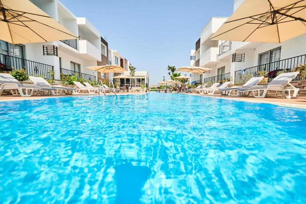 Hotel Halibas outdoor swimming pool with sun loungers in Ulcinj, Montenegro